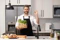 Man cook cooking at kitchen. Chef cook man preparing food. Man cook food in modern kitchen. Cooking healthy salad. Chef Royalty Free Stock Photo