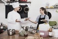 Man cook giving to waitress ready to serve salad Royalty Free Stock Photo