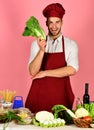 Man in cook hat and apron with salad. Royalty Free Stock Photo