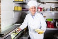 Man cook making kebab dish on kitchen in fast food restaurant Royalty Free Stock Photo