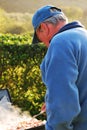 Older Man Enjoying Cooking Outdoors Royalty Free Stock Photo