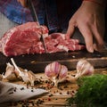 Man cooking beef steaks on the home kitchen Royalty Free Stock Photo