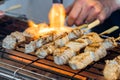 A Man Is Cooking Fresh Tuna Sticks On A Grill Royalty Free Stock Photo