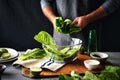 Man cooking green detox salad romaine lettuce Healthy food