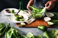 Man cooking green detox salad romaine lettuce Healthy food