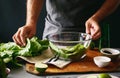 Man cooking green detox salad romaine lettuce Healthy food