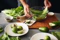 Man cooking green detox salad romaine lettuce Healthy food