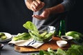 Man cooking green salad romaine lettuce healthy food