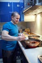 Man cooking at home alone Royalty Free Stock Photo