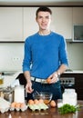 Man cooking at home kitchen Royalty Free Stock Photo