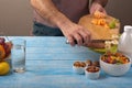 Man cooking at home preparing fruit salad Royalty Free Stock Photo