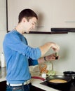 Man cooking omelet Royalty Free Stock Photo