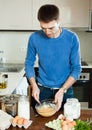 Man cooking omelet with flour Royalty Free Stock Photo