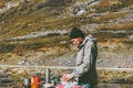Man cooking outdoor in mountains picnic weekend Royalty Free Stock Photo