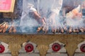 Man cooking skewers on a traditional market in China