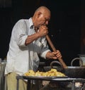 A man cooking street foods at local market in Gaya, India