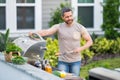 Man cooking tasty food on barbecue grill outdoors. Man cooking barbecue grill at backyard. Chef preparing food on Royalty Free Stock Photo