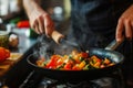 Man cooking vegetables in frying pan