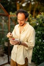 Man cooks at beautiful garden Royalty Free Stock Photo