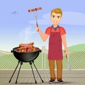 Man cooks skewers and sausages on the barbecue