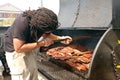 Man Cooks Slabs Of Ribs On Grill At Barbeque Festival Royalty Free Stock Photo