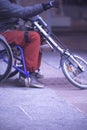 Man in wheelchair on sidewalk