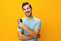 Man copy portrait smiling phone smartphone communication happy mobile cyberspace yellow space phone Royalty Free Stock Photo