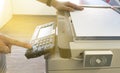 Man copying paper from Photocopier with access control for scanning key card sunlight from window Royalty Free Stock Photo