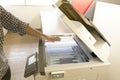 Man copying paper from Photocopier sunlight from window Royalty Free Stock Photo