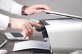 Man copying and scanning documents in office Royalty Free Stock Photo