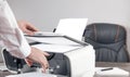 Man copying and scanning documents in office Royalty Free Stock Photo