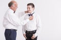 Man correcting the dicky bow of his grandson