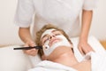 Man cosmetics - facial mask in spa salon