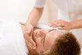 Man cosmetics - facial massage in salon