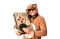 Man in cosplay costume of a cow with reel tape recorder isolated on white background. Guy in the animal pyjamas sleepwear. Funny Royalty Free Stock Photo