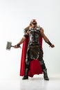 Man in cosplaying Thor isolated on white studio background Royalty Free Stock Photo