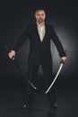man in costume with dual katana swords Royalty Free Stock Photo