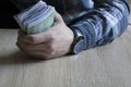 Man count money cash in his hand. Economy, saving, salary and donate concept Royalty Free Stock Photo