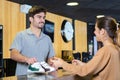 Man at counter borrowing shoes for bowling Royalty Free Stock Photo