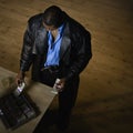 Man counting money at desk Royalty Free Stock Photo