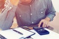 Man counting using calculator and stress in problem with expense Royalty Free Stock Photo