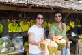 Man Couple Drink Coconut Cocktail On Street Traditional Fruits Market