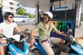 Man Couple On Gas Station Fuel Motor Bike, Happy Smiling Guys Travelling
