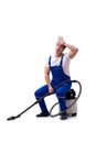 The man in coveralls doing vacuum cleaning on white Royalty Free Stock Photo