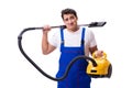 The man in coveralls doing vacuum cleaning on white Royalty Free Stock Photo