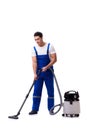 The man in coveralls doing vacuum cleaning on white Royalty Free Stock Photo