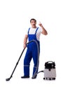 The man in coveralls doing vacuum cleaning on white Royalty Free Stock Photo