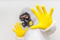 Man in coveralls with gas mask is showing stop gesture Royalty Free Stock Photo