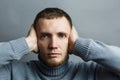 Man covered his ears with his hands Royalty Free Stock Photo