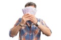 Man covering face with bills
